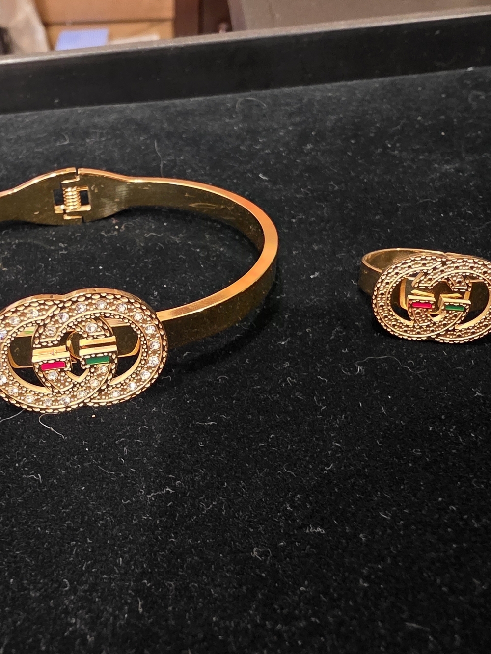 Gold-Tone Interlocking Circle Bracelet with Red & Green Accent